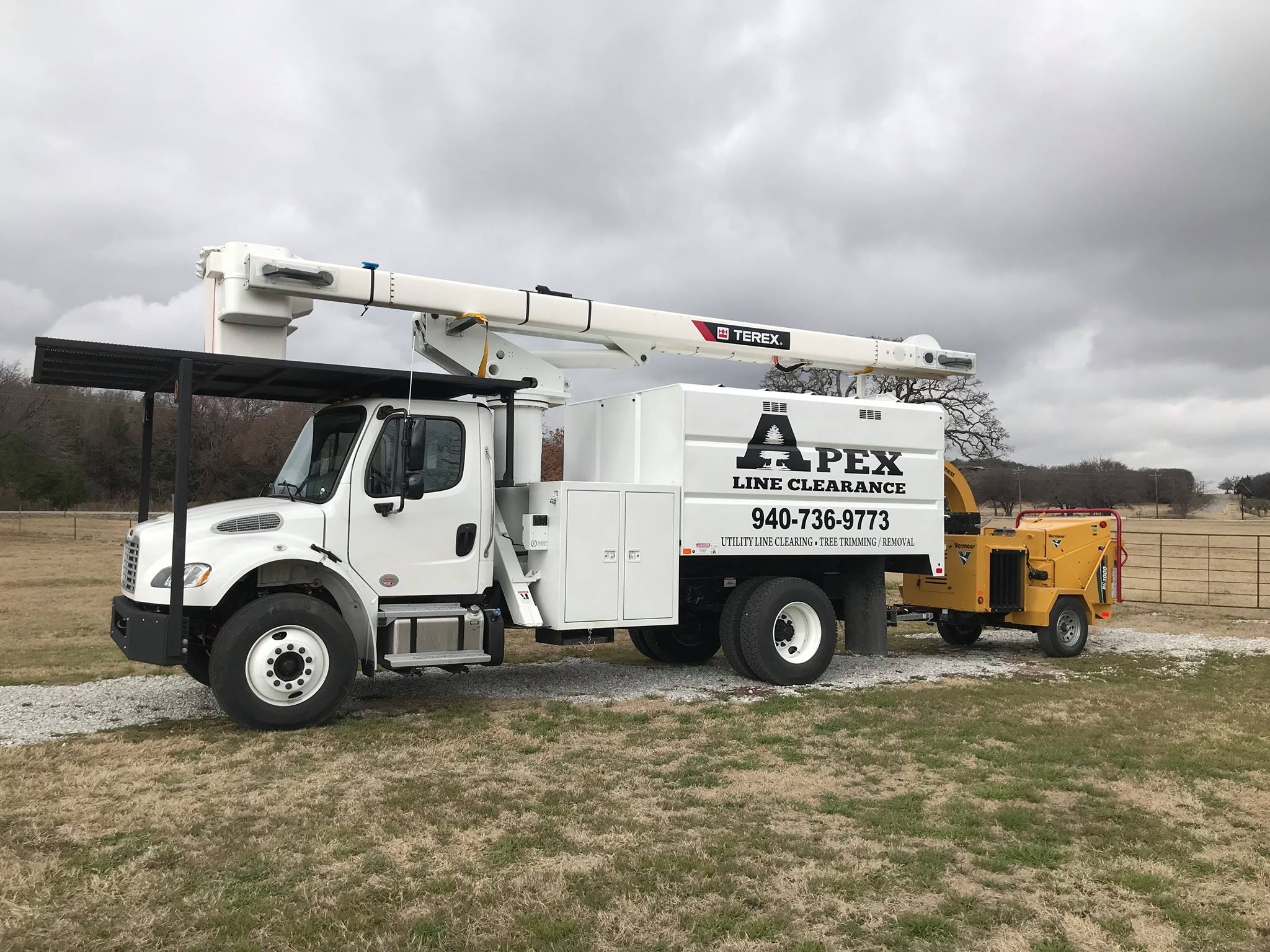 Apex Line Clearing truck pulling Vermeer brush chipper